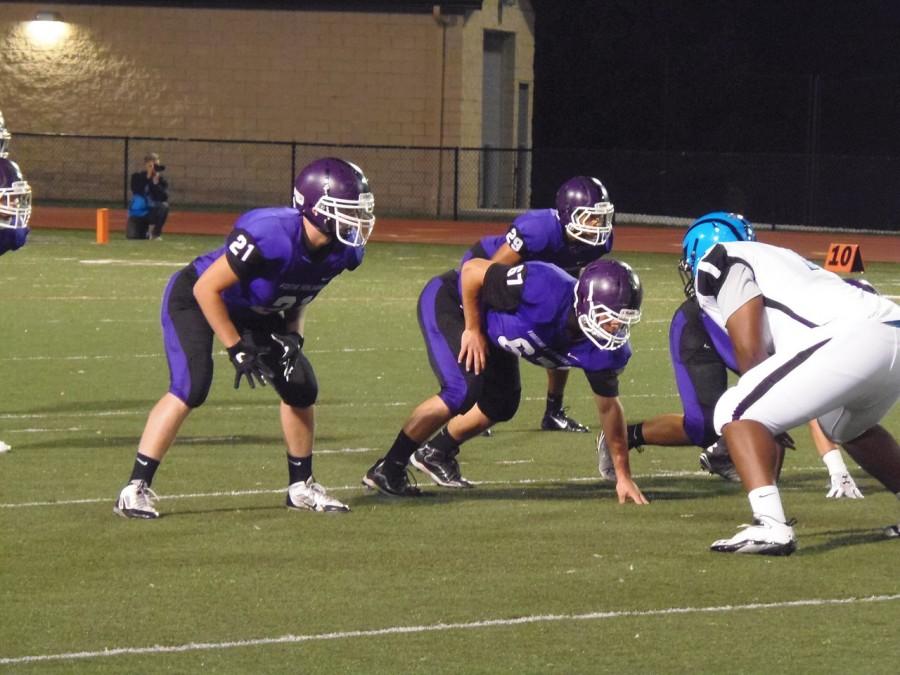 Football players face off at Baldwin High School football game.