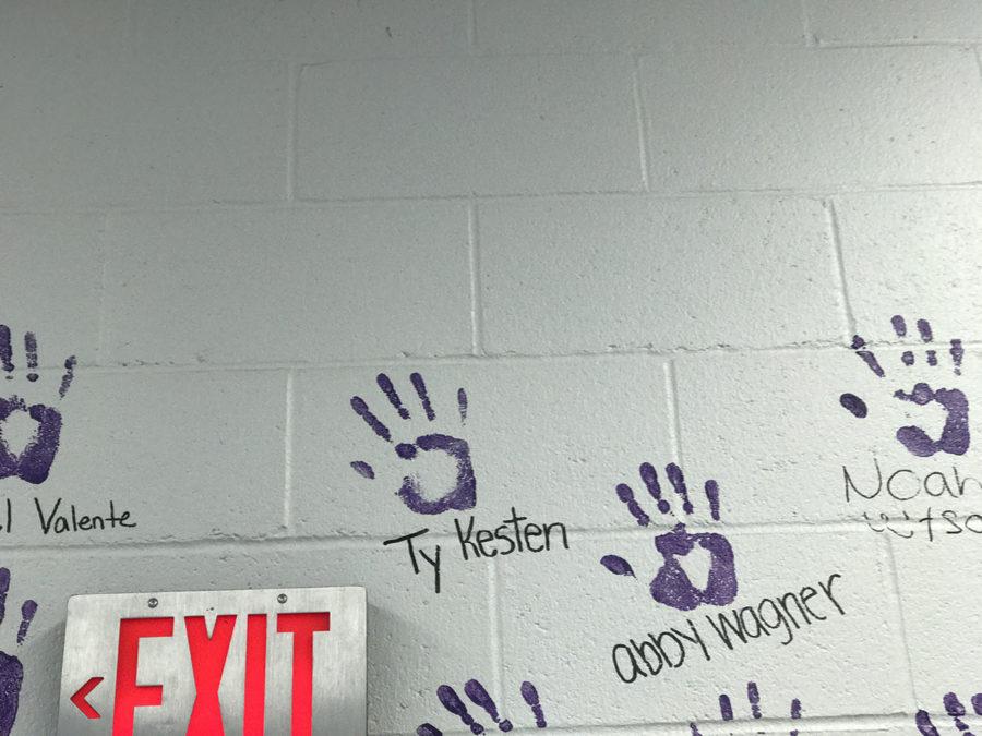 Handprint for Kesten added to senior wall