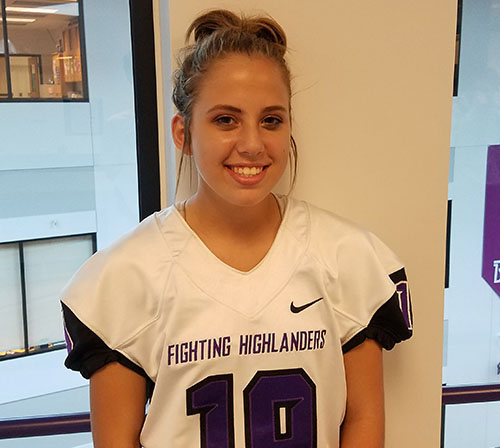 Emma Brandwene preps to kick for the football team