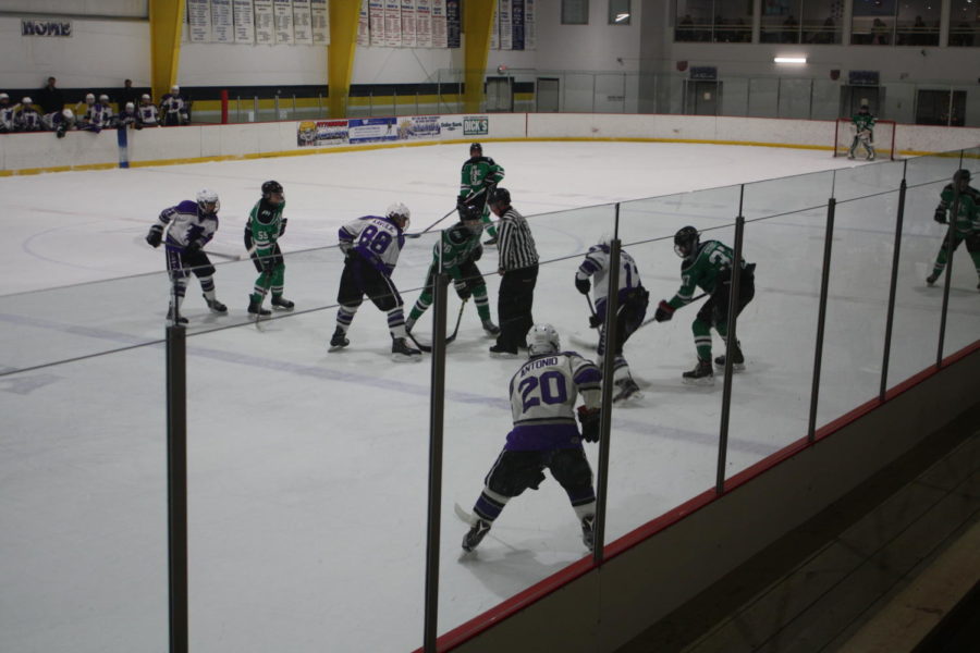 The boys hockey team gets ready to face off at a game. 