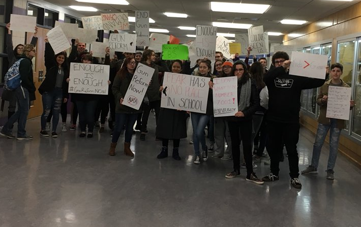 Students holding their signs for the walkout. About 70 Baldwin students walked out of class last year as part of a nationwide movement calling for safer schools and stronger gun legislation.