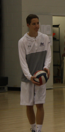 Hitting the ace: Senior Ben Remlinger warms up during practice. The team placed in playoffs again.