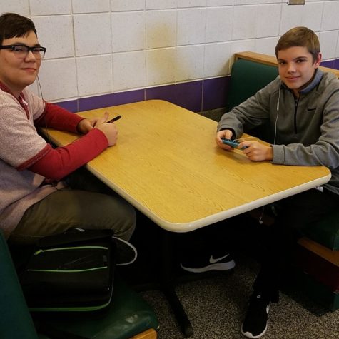 Seniors Ben Daly (left) and Evan Rector sit in the cafeteria at the cafeteria. 