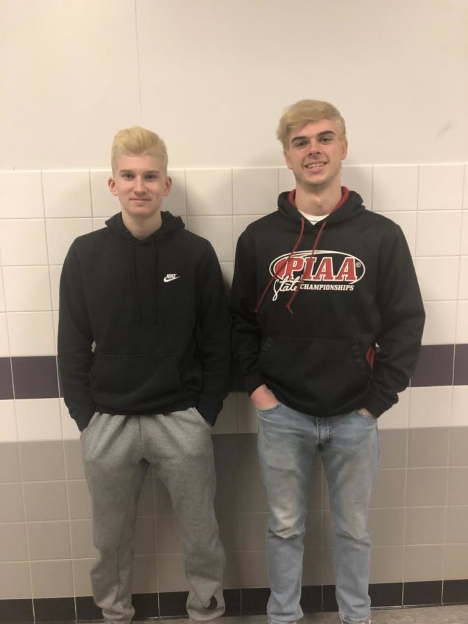 Juniors Noah Fischer (left) and Zack Pender sport blonde hair for hockey playoffs. 