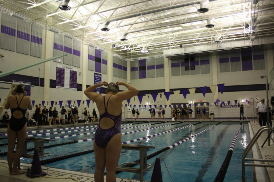 On the block: Senior Katelyn Meyer gets ready for the 100 Butterfly swim.