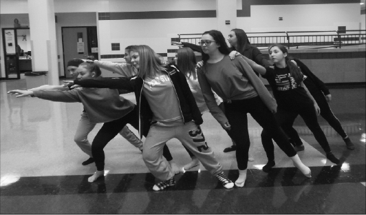 Getting back in action: Members of the Baldwin dance team rehearse a routine in the atrium. The high school’s dance team returned this year, several years after the previous dance team disbanded. 