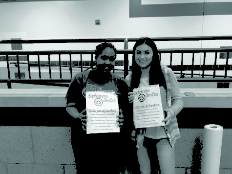 Sophomores Florence Uwizeye and Makayla Mangan
show off Smile Boxes from the sophomore class. The class
has handed out yellow and blue Smile Boxes so far this year.