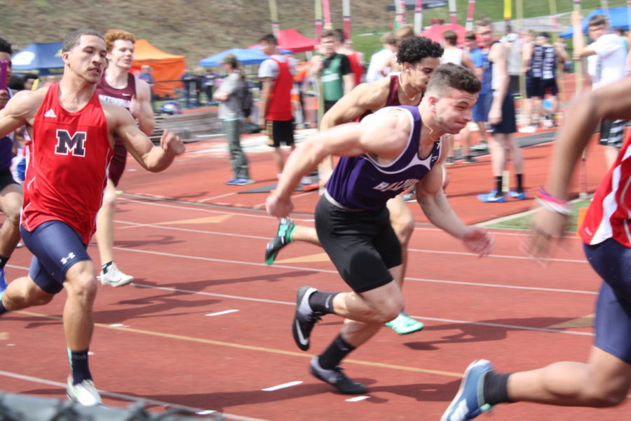 Junior Angelo Priore competes in the 100 meter dash, placing 9th overall. 