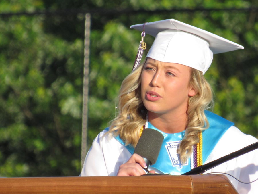 Senior class president Paige Ernst speaks to her senior class during the ceremony. 