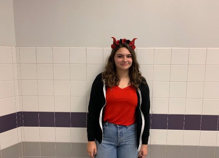 Junior Kaitlyn Oldaker dresses up in red for a devil costume. 