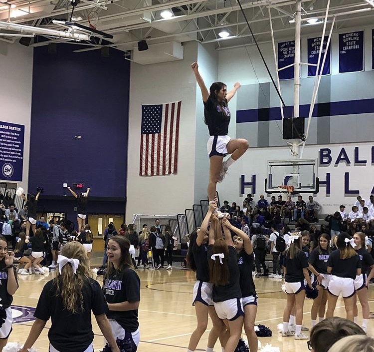 Baldwin cheerleaders perform at a pep rally. The competitive cheer team placed eighth in the nation at Disney. 