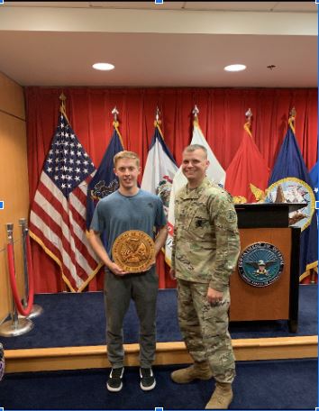 Adam Goldsboro (left) with Sgt. First Class John Knight at Goldsboro’s swear-in ceremony
