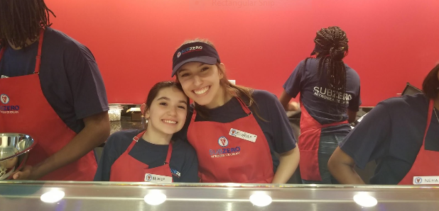 Baldwin sophomore Bianca Puglin (right) with her sister Milana Varon (left) at the family’s ice cream store in Shadyside.