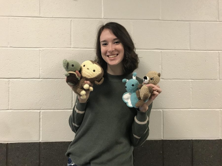 Riley Konesky shows off some of her projects. Konesky hand crochets these animals for her business.