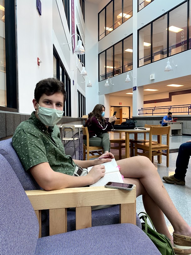 Senior Aidan Greenaway sits socially distant while working on an assignment on the first day of in person school.