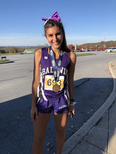 Senior Gina Bolla is the first Baldwin girls cross country runner to earn a medal at states in more than three decades.