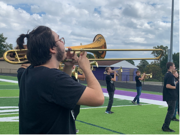 Junior Tim Book plays the trombone. The marching band took third place in the PIMBA championships.