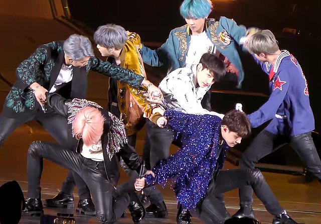 Korean pop group, BTS became a worldwide phenomenon after their debut in 2013. The photo pictures the group performing DNA during their world tour in 2019.