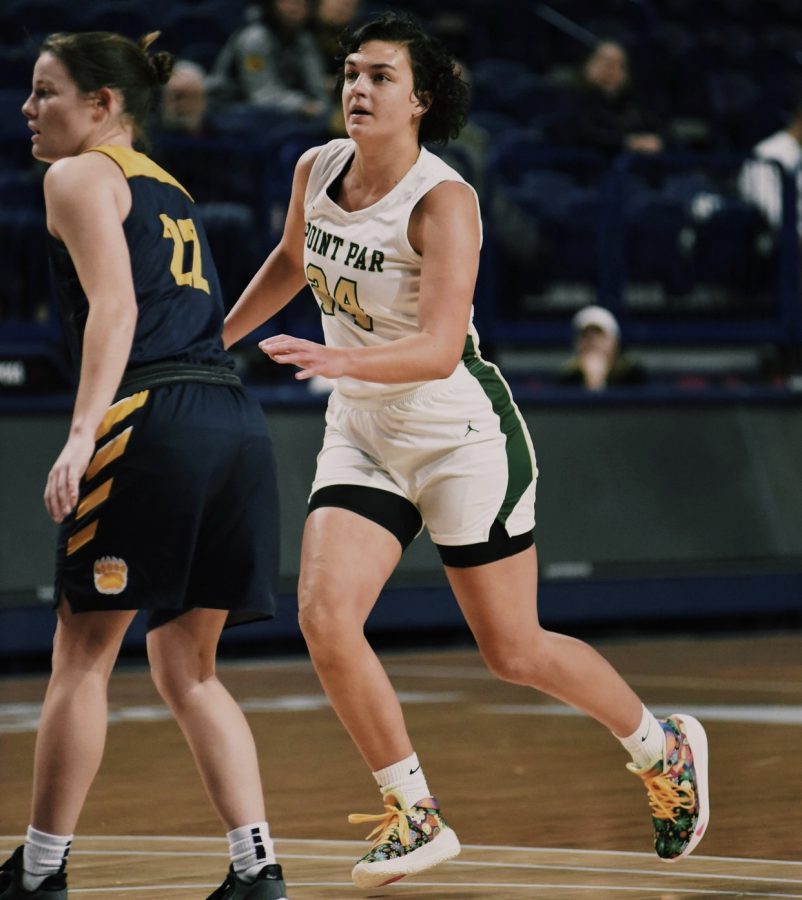 Carly Lutz competes in a basketball game for Point Park University.