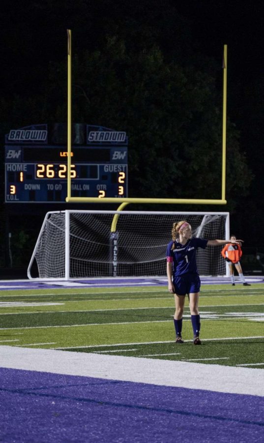Megan Leary stands on the Baldwin soccer field during a home game.