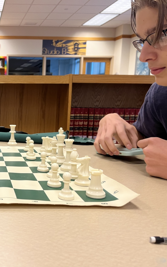 The+Baldwin+chess+club+President%2C+Joey+Priano%2C+studies+his+next+move.+