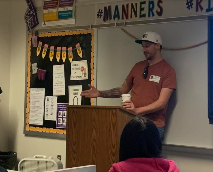 Pasta guy Ryan Peters talks to students in Michelle Kilburns business classes. 