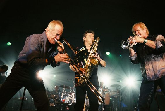 The horn section of the band Chicago performs in concert. 