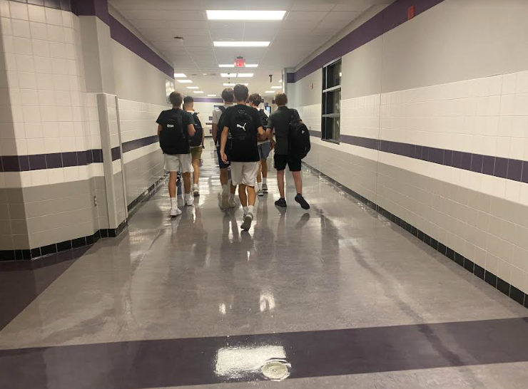 A group of junior students walk to class after fourth period gym.