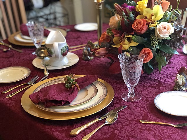 The Thanksgiving holiday should be a time of gratefulness and gathering.  Thanksgiving Table by Missvain is licensed under  CC BY 4.0 DEED.