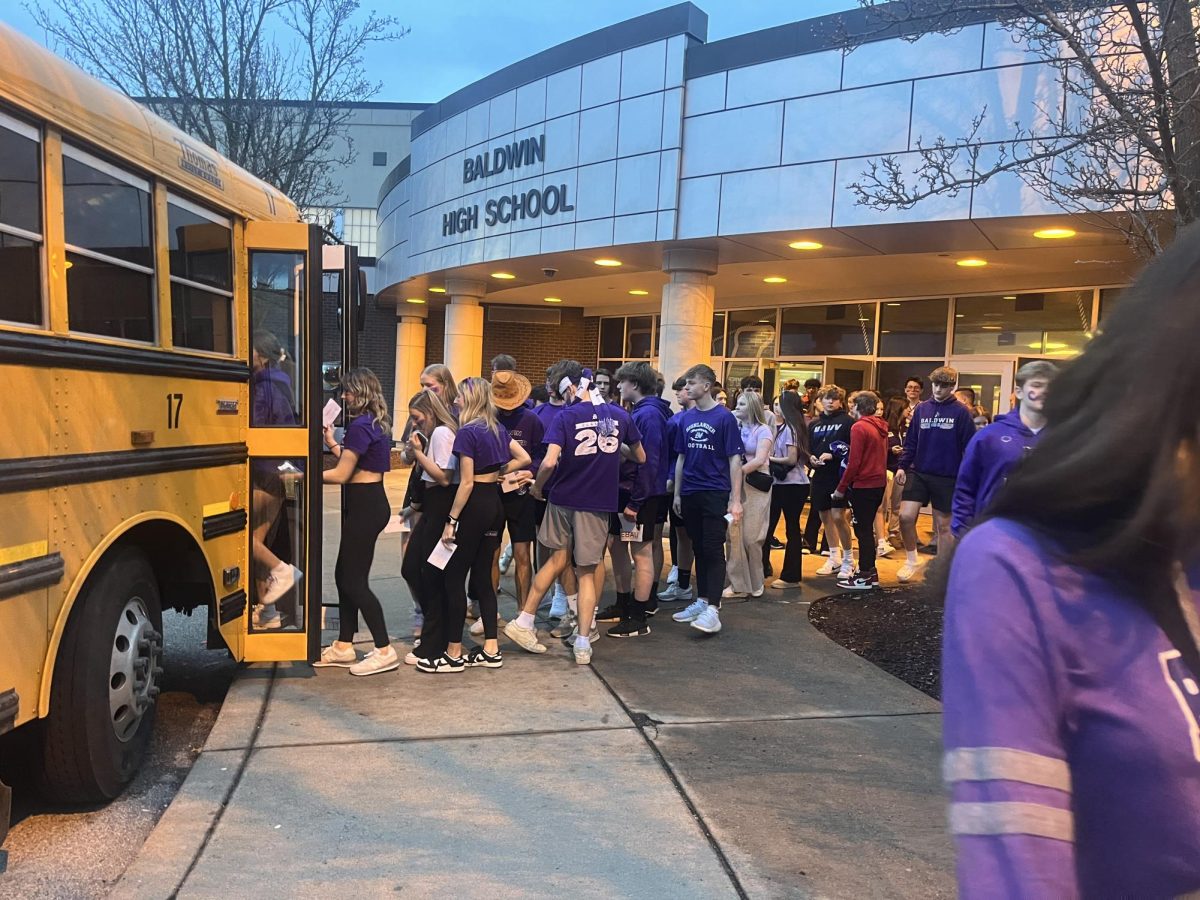 The Baldwin students board the fan bus to travel to the game.