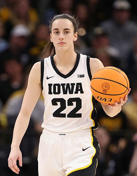 Caitlin Clark is Iowas star player, with her accurate shooting and assists to her teammates.CaitlinClarkBigTen by John Mac is licensed under CC BY-SA 2.0 DEED