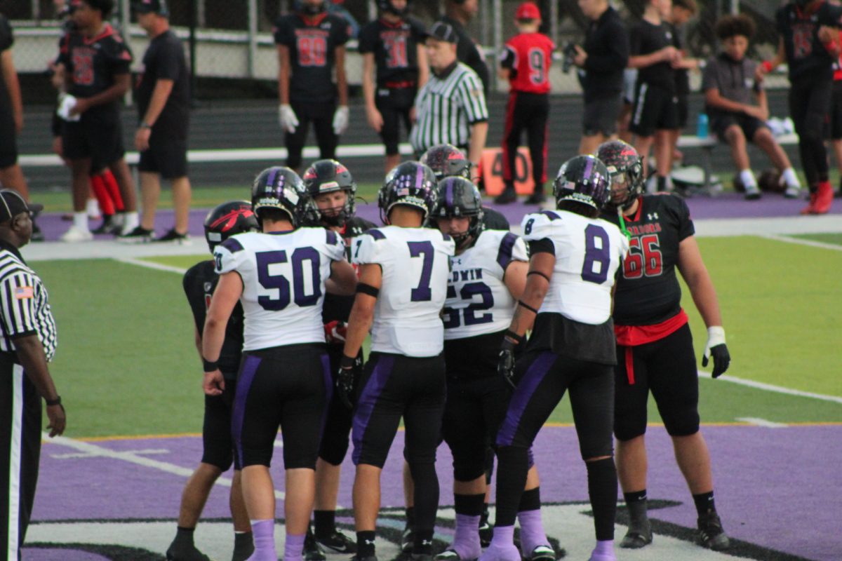 Baldwin's team captains shake hands with Elizabeth Forward's team captains before the game.  