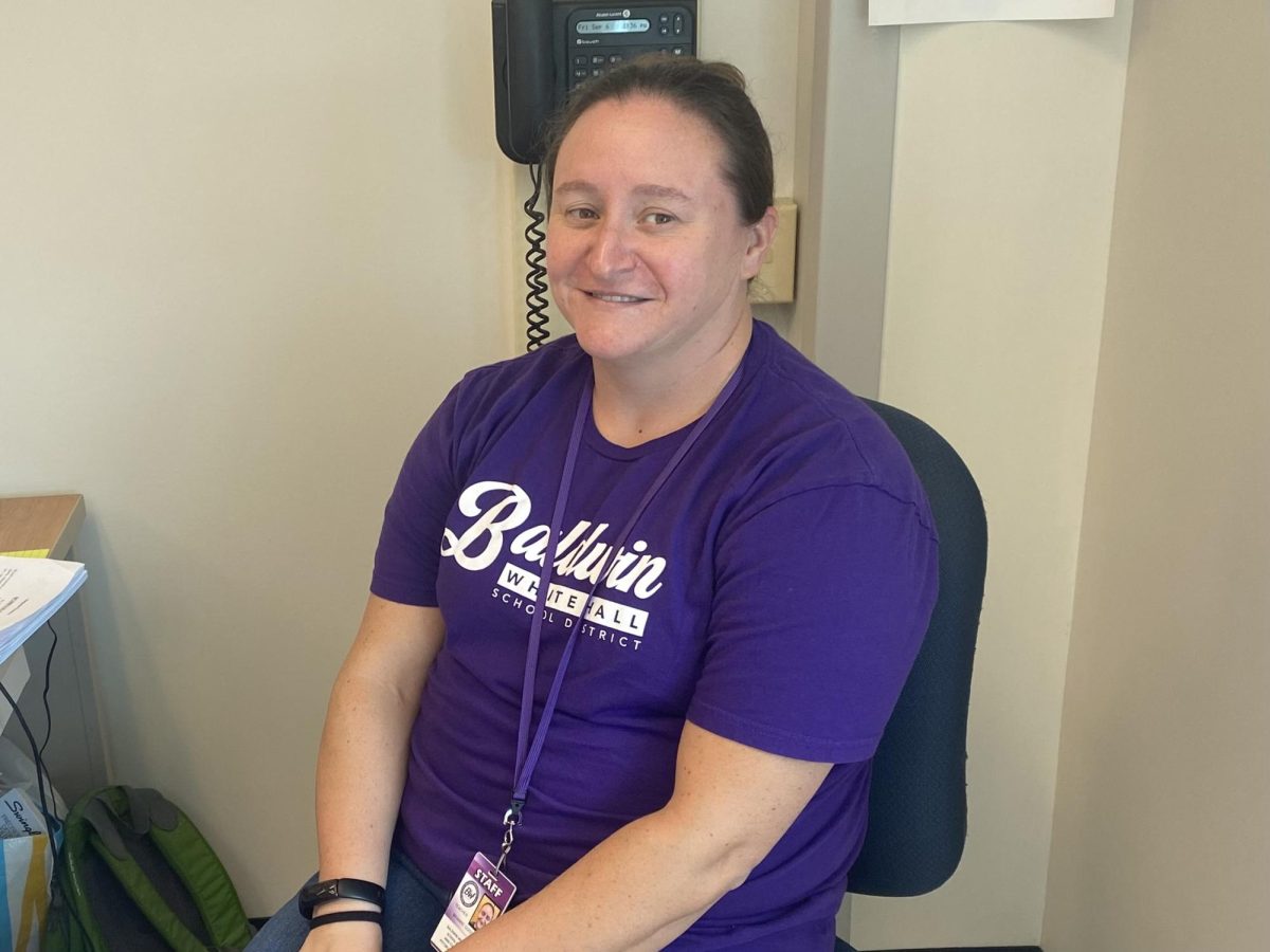 Science teacher Brianne Goodwin sits at her desk