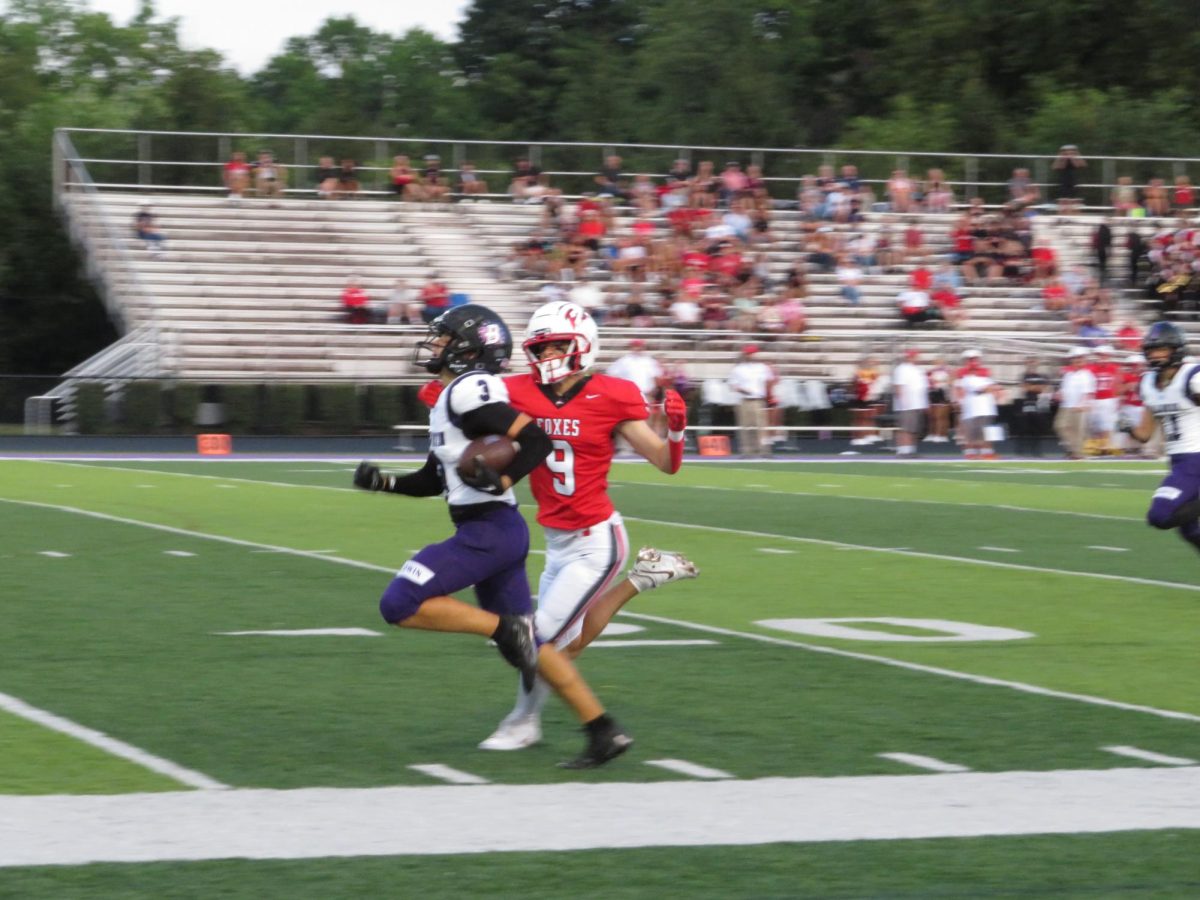 Junior Noah Saccani carries the ball down the field against Fox Chapel on Aug. 30.