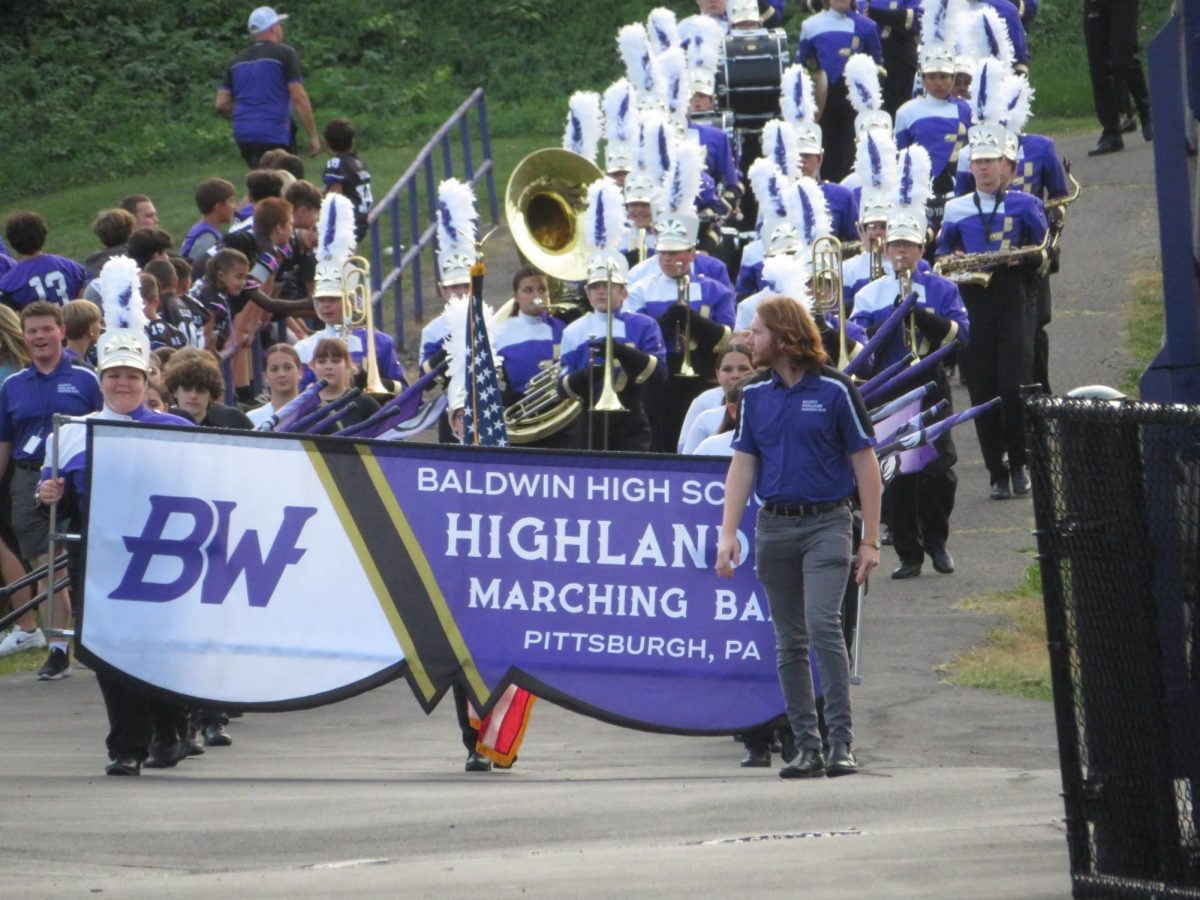 The band comes down the track ramp before the game against Elizabeth Forward.