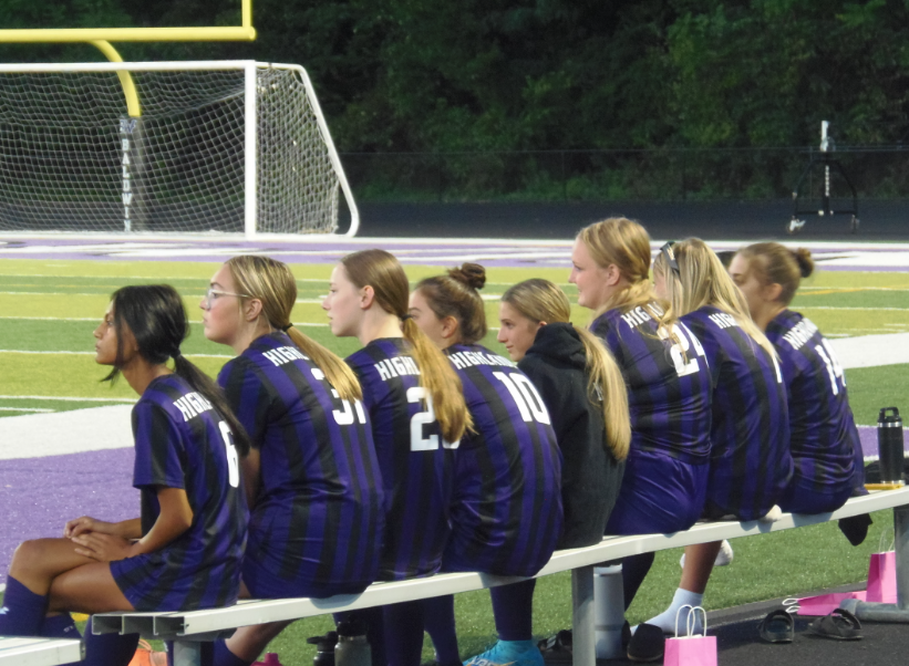 The Baldwin girls soccer team watches their teammates during the game. 