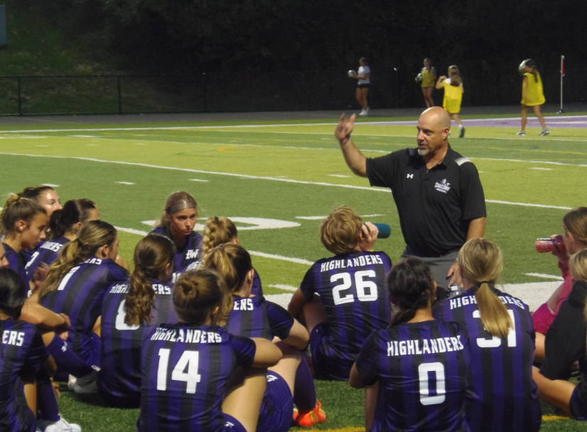 The Baldwin girls soccer team discusses game strategies at half time. 