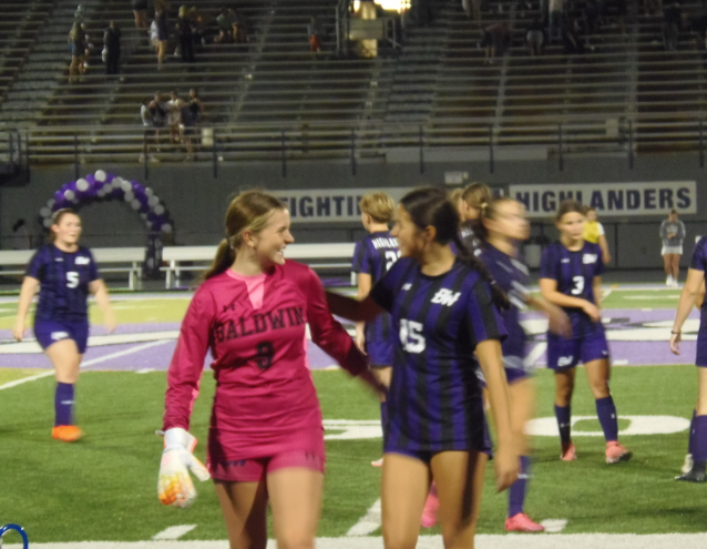 Teammates celebrate after winning the game. 