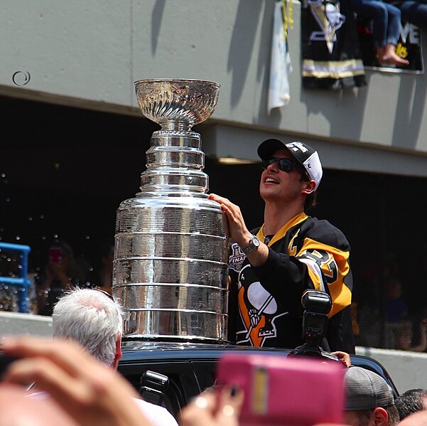 Crosby no doubt is a valued and loved player not just among fans but among his teammates as well. Sidney Crosby with the Cup by daveynin is licensed under  CC BY 2.0 DEED.