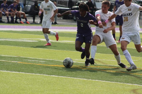 Senior Chris Sandy runs with the ball in TJ's territory.