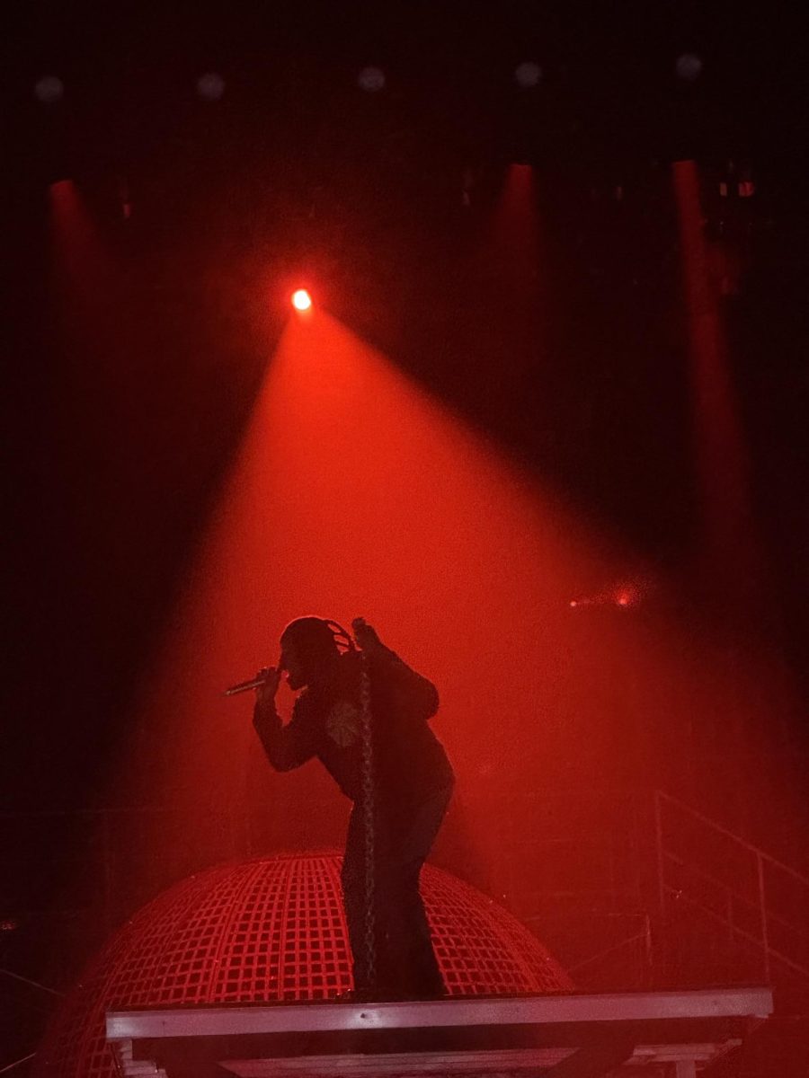 Toliver preforms "Swangin’ on Westheimer" on an elevated stage.