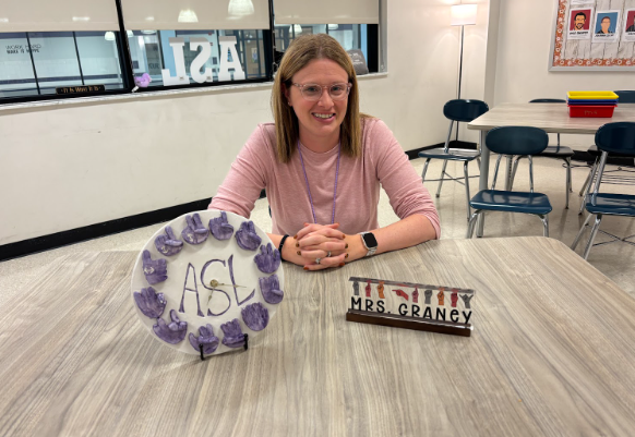 ASL Teacher Lindsey Graney sits at one of the desks provided by the state grant.