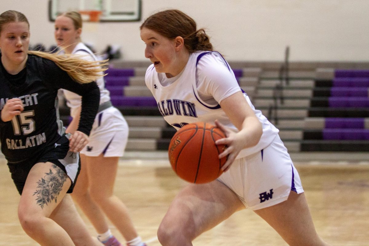 Junior Jacey Klingensmith drives to the rim in the first half against Albert Gallatin.