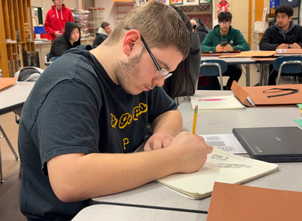 Freshman Logan Boyce works on pattern practice in Studio Art 1 on Thursday.