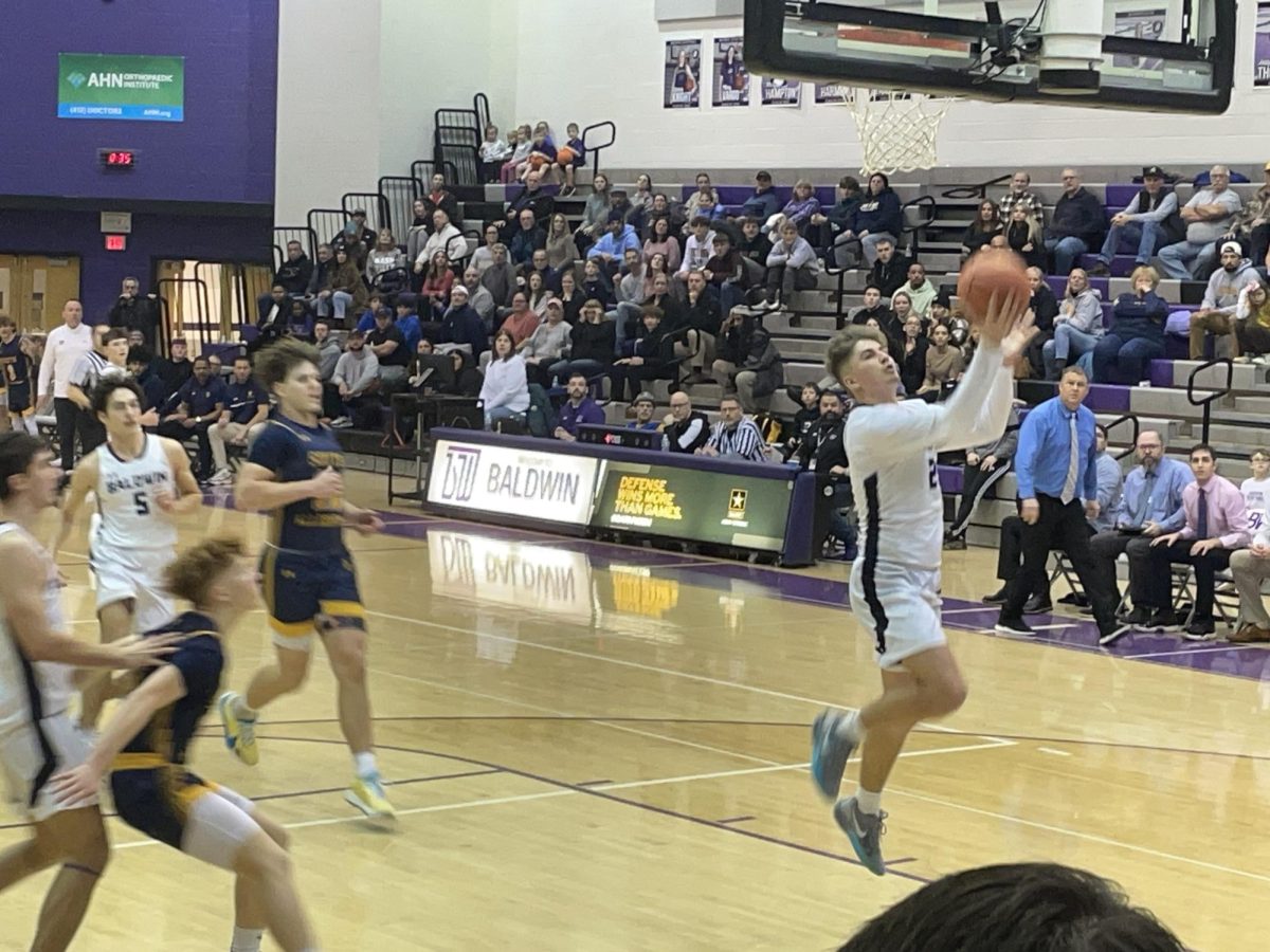 Senior Caden Cherico goes up for a layup on a fast break. 