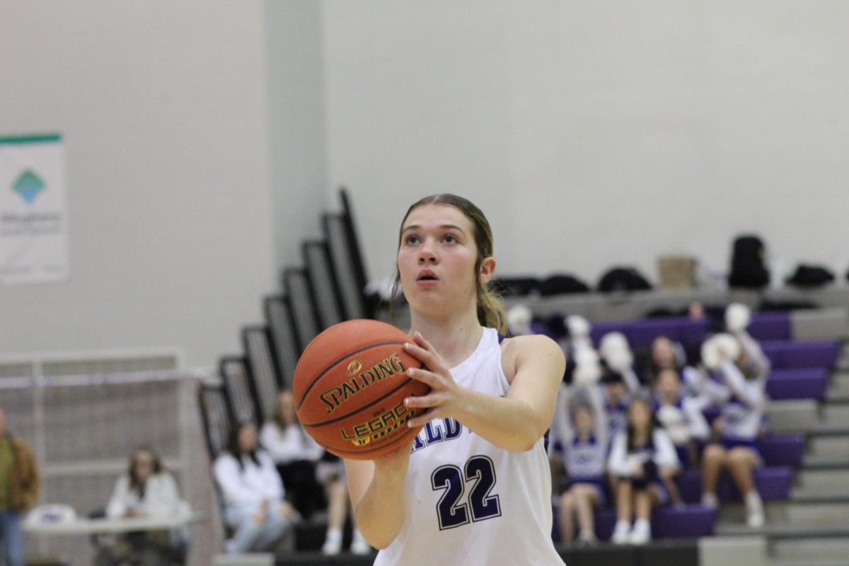 Sophomore Kelsey Meyer loads up in her stand to take a shot. 