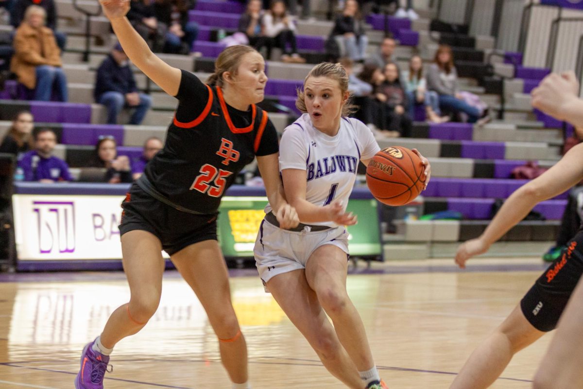 Sophomore Lynsey Bernotas drives to the rim for a layup in the first half.