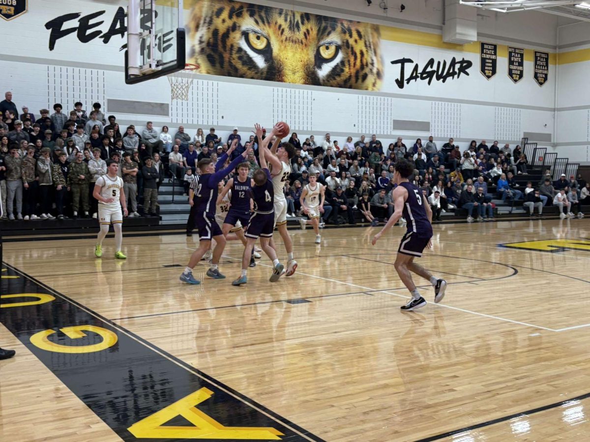 Multiple Baldwin defenders block a TJ shooter during his shot.