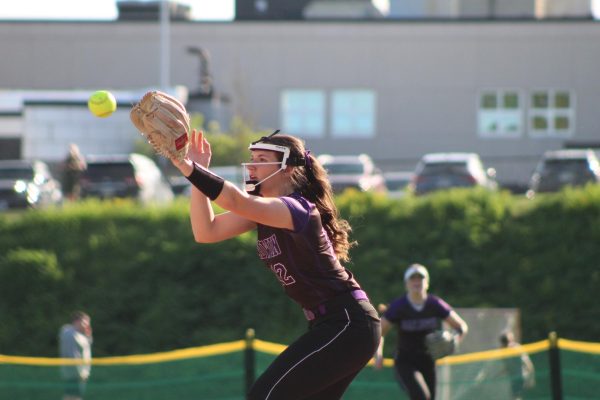Senior Kaylee Smolko gets ready to catch a  ball to get a player out at first. 