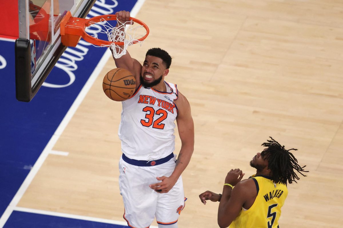 May 29, 2025; New York, New York, USA; New York Knicks center Karl-Anthony Towns (32) dunks against Indiana Pacers forward Jarace Walker (5) in the fourth quarter during game five of the eastern conference finals for the 2025 NBA Playoffs at Madison Square Garden. Mandatory Credit: Brad Penner-Imagn Images
